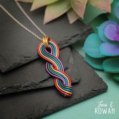 This Aluminum Wire 5 Strand Twist Pendant Necklace is a beautiful gift for those enchanted with beautiful colors and art! This Pendant Necklace features colorful aluminum wire that has been carefully handmade in our studio. This beautiful Pendant has an eye-catching appearance that would look great with any outfit! This Aluminum wire Pendant necklace measures 65 mm in overall length, 60 mm in length and 20 mm at widest width. We are happy to offer this necklace with your choice of choker, cord, Handmade Multicolor Jewelry For Mother's Day, Multicolor Wire Wrapped Necklace For Gift, Whimsical Multicolor Wire Wrapped Jewelry, Artisan Rainbow Necklaces As Gifts, Artisan Rainbow Necklaces For Gifts, Artisan Rainbow Necklace As Gift, Artisan Rainbow Jewelry As Gift, Artisan Rainbow Necklace For Gift, Artisan Rainbow Jewelry For Gifts