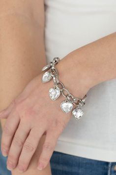 White heart-shaped gems are encased in sleek silver frames that swing from an oversized silver chain, creating a sparkly fringe around the wrist. Features an adjustable clasp closure. Sold as one individual bracelet. P9RE-WTXX-445XX Paparazzi Jewelry Images, White Bracelet, White Bracelets, Silver Frames, Rose Quartz Stone, Paparazzi Accessories, Rhinestone Heart, Blue Gems, White Rhinestone