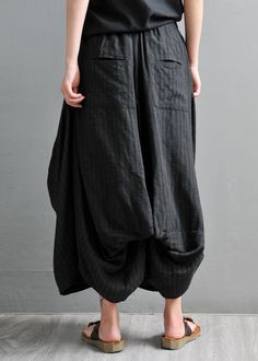 Black Asymmetrical Elastic Waist Pockets Pants Skirt SummerFabric: Cotton 45%, Linen 55%Size & Fit: This garment fits true to size.Length: Size 5XL measures 34.32"from waist to hem.Waist:Fitted - elastic waist allows stretch Hip: Loosely Fitted. room for hips. Hand Wash Cold. Baggy Black Harem Pants For Summer, Asymmetrical Baggy Bottoms For Spring, Fitted Black Harem Pants For Summer, Baggy Asymmetrical Bottoms For Spring, Spring Baggy Asymmetrical Bottoms, Fitted Black Lagenlook Bottoms, Black Lagenlook Pants For Spring, Spring Black Lagenlook Pants, Asymmetrical Hem Bottoms With Pockets For Spring