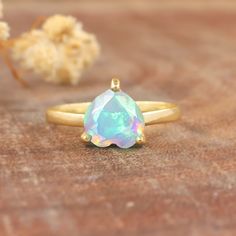 White fire Ethiopian opal wedding ring for women, Vintage fire opal ring, Minimalist ring, October birthstone, Gold ring, 925 Sterling silver ring, Gift for her.  *Other Similar Jewelry Available Here* https://www.etsy.com/shop/AreebaJewelry Details:- Gemstone - Ethiopian opal  Stone Color - Natural  Stone Setting - Prong Quality - AAA Grade Rize Size - 4 US TO 9 US Available Type - 100% Natural  Shipping service - Free worldwide shipping service About AreebaJewelry:- AreebaJewelry takes great p Minimalist Opal Birthstone Promise Ring, Minimalist Opal Rings For Gifts, Minimalist Opal Rings For Gift, Minimalist Opal Ring As A Gift, Opal Crystal Ring With Birthstone For Gifts, Dainty Solitaire Opal Promise Ring, Opal Birthstone Crystal Ring As Gift, Minimalist Opal Birthstone Ring For Anniversary, Opal Birthstone Crystal Ring For Gift