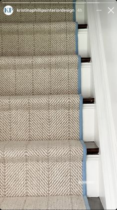 a carpeted stair with blue tape on it