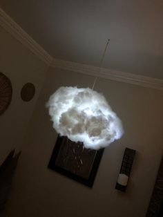 a white cloud floating in the middle of a room