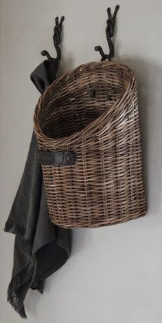 a wicker basket hanging on the wall