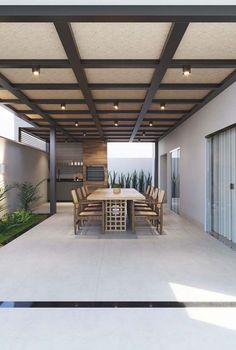 an outdoor dining area with table and chairs