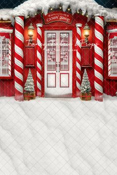 a red and white building with candy canes on it's front door in the snow