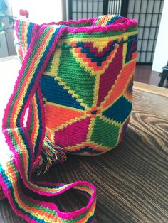 "Beautiful Colombian Wayuu Mochila Bag!! These are all one of a kind, hand crocheted acrylic, made with love by women of the Wayuu Tribe of northeastern Colombia. This is the medium size that measures approximately 7\" across and 8\" tall. These stunningly beautiful bags are a functional, stylish way to tote around all your goodies. Water bottle, snacks, phone, wallet, and more! The Wayuu crochet is a unique, traditional art form that has been passed from mother to daughter for many generations. Wayuu Bag, Native Design, Medium Bags, Medium Size, Beautiful Bags, Traditional Art, Hand Crochet, Purses And Handbags, Shoulder Bag