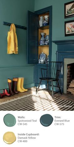 a living room with blue walls and yellow accessories on the fireplace mantel, painted in farrow teal