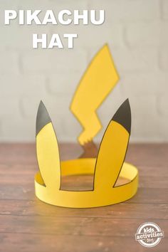 a paper crown with the words pikachu hat on it