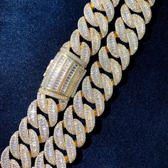 Elevate your style with our 19mm All Over Baguette Curve Cuban Link Bracelet, a symbol of opulence and sophistication. Meticulously crafted with dazzling baguette stones adorning every curve, this bracelet exudes luxury and elegance. Perfect for making a bold fashion statement, whether for special occasions or everyday wear. Discover the pinnacle of fine jewelry craftsmanship and adorn your wrist with this exquisite piece that commands attention wherever you go. Product Type: Bracelets Gender: U Simple Chain Necklace, Baguette Necklace, Gold Cuban Link Chain, Cuban Link Bracelet, Miami Cuban Link Chain, Zircon Necklace, Miami Cuban Link, Cuban Link Chain Necklaces, Rock Jewelry