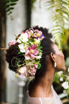 an instagram with flowers in her hair