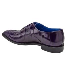 This patchwork captoe dress shoe from Belvedere features a genuine ostrich leg and eel skin upper. This shoe comes in a leather sole, with a cushioned leather insole. Made by hand by artisans in Mexico. Leather Dress Shoes With Crocodile Pattern, Fitted Leather Dress Shoes With Crocodile Pattern, Formal Purple Leather Shoes With Leather Sole, Fitted Crocodile Pattern Dress Shoes With Round Toe, Fitted Dress Shoes With Crocodile Pattern And Round Toe, Fitted Wingtip Dress Shoes With Crocodile Pattern, Fitted Crocodile Pattern Wingtip Dress Shoes, Classic Fitted Oxfords With Crocodile Pattern, Fitted Leather Snip Toe Shoes For Derby