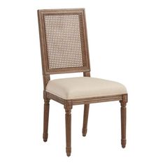 a wooden chair with a beige upholstered back and seat cushion on the side