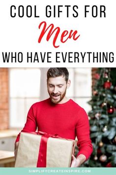 a man holding a gift box with the words cool gifts for men who have everything