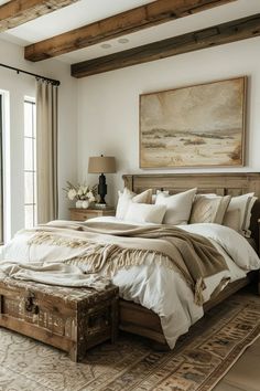 a large bed sitting next to a window in a room with wooden beams on the ceiling