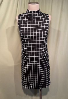 Sweet Original Vintage 60s Black & White Poly Blend Grid Pattern Sleeveless Shift Dress Bust 34 Waist 32 1960s Paper Dress, Black Fitted Mod Dress, Mod Sleeveless Dresses With Buttons, 60s Checkered Dress, Vintage Shift Dress, 60s Fashion Dresses, 1960s Shift Dress, Gogo Dress, Mod Dress 60s