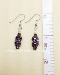 Life is short - wear something pretty! A beautiful beaded dangle purple earring set that will be a great wardrobe accessory.Earrings are made using surgical steel ear wires. I use wrapped loops to give the earring a more finished look. Earrings come with rubber ear backs that slide on to keep earrings from falling out of ears.Color: gunmetal, purple pearl Earrings length: see picture******************************** ****This item is handmade with care for you, it needs 3-5 BUSINESS DAYS FOR PRODU Hypoallergenic Purple Round Bead Earrings, Hypoallergenic Purple Beaded Earrings, Purple Metal Beaded Drop Earrings, Adjustable Purple Wire Wrapped Beaded Earrings, Adjustable Wire Wrapped Purple Beaded Earrings, Purple Dangle Beaded Earrings Wire Wrapped, Nickel-free Purple Beaded Earrings With Round Beads, Purple Wire Wrapped Beaded Earrings For Gift, Nickel-free Purple Beaded Earrings