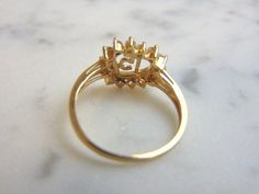 A WOMENS VINTAGE ESTATE 14K GOLD, LA QUINCEANERA HEART RING. THE RING IS A SIZE 6.75 AND WEIGHS 2.4g. THE STONES ARE EITHER CUBIC ZIRCONIA OR CRYSTALS. THIS IS A LOVELY GIFT FOR A YOUNG WOMAN TURNING 15 YEARS OF AGE. ANY QUESTIONS PLEASE DONT HESITATE TO ASK. BE SURE TO CHECK OUT SOME OF MY OTHER GREAT ITEMS UP FOR SALE. THANK YOU Estate Style 14k Gold Rings, Estate 14k Yellow Gold Rings, Vintage Yellow Gold Pear-shaped Diamond Ring, Vintage Pear-shaped Yellow Gold Diamond Ring, Heirloom Yellow Gold Cluster Ring For Anniversary, Estate Yellow Gold 14k Gold Rings, Gold Pear-shaped Cluster Ring For Anniversary, Classic Yellow Gold Pear-shaped Cluster Ring, Estate Yellow Gold Rings For Anniversary