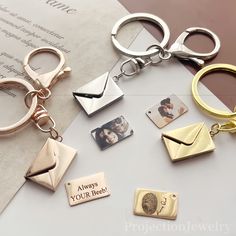 several different types of personalized key chains and magnets on top of a piece of paper