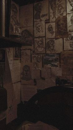 a room filled with lots of papers and pictures on the wall