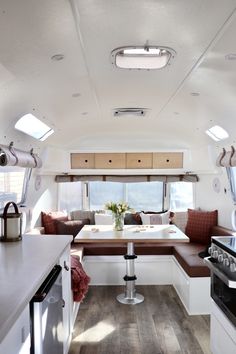 the interior of a camper is clean and ready to be used as a kitchen