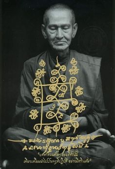 an old man sitting down in front of a book cover with writing on the pages