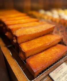 several slices of cake sitting on top of a metal rack