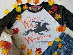 Even every good cowgirl can be a little witchy and western sometimes. This tee is the perfect Halloween shirt! Be a little western or witchy, in this ultra soft triblend 3/4 sleeve raglan tee. So comfy you won't want to take it off..... Soft-washed Tri-blend Fall Tops, Witchy Letter Print T-shirt For Fall, Western Style Relaxed Fit T-shirt For Fall, 3/4 Sleeve Tops With Graphic Print For Fall, Western Style Crew Neck Tops For Fall, Fall Relaxed Fit T-shirt With 3/4 Sleeves, Fitted Spooky T-shirt For Fall, Fall Witchy Graphic Print T-shirt, Witchy Cowgirl