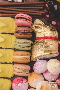 an assortment of macaroons and pastries on display