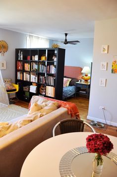 a living room filled with furniture and a white table