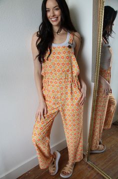 These Walkin On Sunshine Flower Overalls are perfect for any sunny day outing. Made with soft and breathable fabric, these overalls feature a beautiful flower pattern that will brighten up any look. Stay comfortable and stylish with these must-have overalls. 100% Light woven breathable polyester Curvy Girl Dress, Rancher Hat, Casual Bottoms, Rings Jewelry Fashion, Overall Dress, Gold Fashion, Jumper Dress, Blazer Coat, Kids Tops