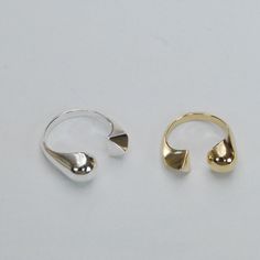 This perfectly asymmetrical split shank ring is the geometric accessory of your dreams. It's slightly adjustable, so it will move with you as your body changes through the seasons of the year and through life. Modern Adjustable Open Ring Jewelry, Modern Open Band Midi Rings With Polished Finish, Modern Polished Finish Open Band Midi Rings, Modern Adjustable Open Band Midi Rings, Adjustable Stackable Open Rings With Polished Finish, Adjustable Polished Stackable Open Rings, Adjustable Stackable Polished Open Rings, Modern Adjustable Open Ring, Geometric Accessories