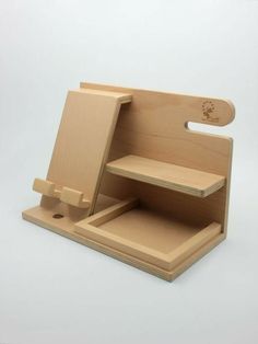 a small wooden stand with an open drawer