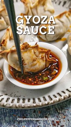 gyoza sauce in a white bowl with chopsticks sticking out of it