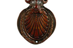 an ornate wooden door handle on a white background