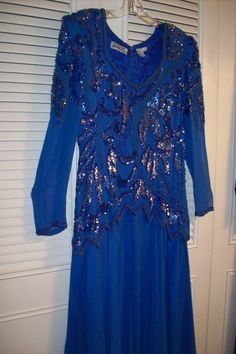 "Splendid evening in store! Royal blue dressy evening dress to end all. Bodice is sequins and bugle beads. All in tact. The skirt has an underskirt of royal blue satin. The over-skirt is silk chiffon. The dress is silk. See the last two pictures showing the back. The bust measures 40\", waist area 32\". Overall length 52\". Maxi length! This showpiece of a dress will be so happy to be waltzed in at a special occasion. It is absolutely PERFECT ! Look no further if this is your size ! No flaws of Mardi Gras Dress, Evening Formal, Bugle Beads, Blue Satin, Cotton Pants, Silk Chiffon, Mardi Gras, Clothing Items, Evening Dresses