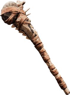 a very old looking wooden object with spikes on it's head and neck, against a white background