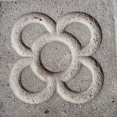 a cement design with circles in the middle