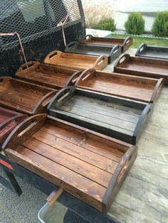 several wooden trays sitting on the back of a truck