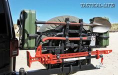 the back end of a truck with tools attached to it