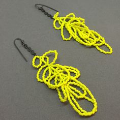 these are some of my personal super faves. there is never too much neon yellow!!!! Yellow Handmade Chandelier Earrings With Round Beads, Handmade Neon Yellow Jewelry For Summer, Handmade Neon Jewelry For Summer, Yellow Beaded Chandelier Drop Earrings, Artisan Yellow Beaded Drop Earrings, Adjustable Artistic Yellow Earrings, Neon Yellow Earrings, Art Earrings, Neon Yellow