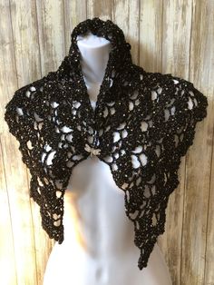 Super soft and glittery hand crocheted black shawl for child. Great gift for Halloween, birthday or any occasion for a daughter, niece or any lucky child. I hand crocheted this wrap using sequined fine black glitter yarn and a size G crochet hook using a pattern called Anna by Katya Novikova (https://www.lovecrafts.com/en-us/p/anna-crochet-pattern-by-katya-novikova). The shawl measures 42.5 inches across the top and 18 inches top to bottom and contains alternate rows of lace arches and shells, d Black Winter Party Shrug, Winter Party Black Shrug, Handmade Shawl In One Size - Perfect For Gifts, Handmade Black Shawl For Winter, Fitted Black Shawl For Party, Black Party Shawl, Glitter Yarn, Niece Gifts, Black Shawl