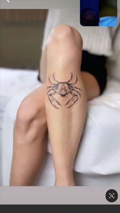 a woman's leg with a tattoo on it, and the bottom half of her legs