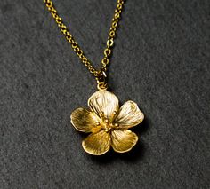 Gold Flower Necklace. Necklace in Gift Box. | Etsy Gold Nickel-free Flower Pendant Necklace, Gold Flower Shaped Nickel Free Necklace, Gold Charm Necklace With Flower Pendant For Her, Brass Flower Pendant Necklaces As Gifts, Brass Flower Pendant Necklace For Gift, Brass Flower Pendant Necklace As Gift, Gold Flower Shape Charm Necklaces As Gift, Gold Flower Shaped Charm Necklaces For Gifts, Gold Flower-shaped Charm Necklaces For Gifts