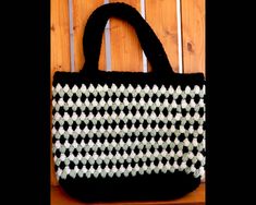 "Hand-crocheted tote bag. 16\" wide, 14\" deep. Handles are 18\" with a drop length of 8\" Attractive puff braid stitch in sage green, black and cream. This bag is unlined. Made of easy care, non allergenic acrylic yarn. Machine wash and dry gentle cycle in cool water." Black Crochet Bag With Granny Square For Everyday Use, Black Tote Bag With Granny Square Detail, Black Granny Square Bag For Daily Use, Black Granny Square Crochet Tote Bag, Black Granny Square Tote Bag, Braid Stitch, Beach Bag Crochet, Puff Stitch, Crochet Purse