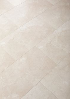 a white toilet sitting on top of a tiled floor