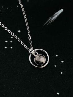 "This delicate pendant is positively darling. This petite necklace is available in sterling silver or 14k gold and is personalized with the moon phase that had been in the sky during an important occasion in your life! Was it the day you were born? Married? Had children? A life-changing experience? Whatever the moment, there was a phase of our moon shining down on it. This itty bitty moon hangs in the middle of a delicate gold or silver halo. To order, please provide the following information in Sterling Silver Moon Phase Necklace In White Gold, Sterling Silver White Gold Necklace With Moon Phase, White Gold Moon Phase Necklace, White Gold Sterling Silver Moon Phase Necklace, White Gold Sterling Silver Necklace With Moon Phase, Moon-shaped Sun And Moon Design Jewelry For Anniversary, Celestial Moon Phase White Gold Jewelry, Celestial White Gold Moon Phase Jewelry, Celestial Style Moon Charm Necklace For Anniversary