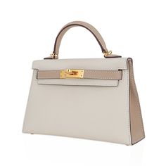 Guaranteed authentic Hermes Kelly HSS 20 Sellier bag featured in coveted Craie and Trench.A stunning neutral color combination for year round wear. Epsom leather accentuated with Gold hardware.Comes with signature Hermes box, shoulder strap, and sleeper.Please visit our Kelly 20 Collection to see our large selection available for you.NEW or NEVER WORN.Unparalleled in trust, integrity and service, mightychic offers a beautiful selection of Hermes at your fingertips.final sale BAG MEASURES:LENGTH Hermes Crocodile Bag, Hermes Special Order, Hermes Evelyn Bag, Mini Kelly, My Style Bags, Limited Edition Bag, Work Handbag, Hermes Kelly Bag, Green Handbag