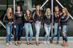 a group of young women standing next to each other