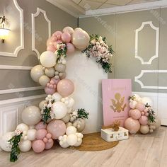 balloons and flowers are arranged on the floor