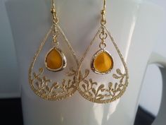 Color = Mustard, Polished Gold Frame Material = Glass, Brass Size = 13mm x 13mm All items come wrapped individually in a ribboned gift box. Thank you for looking. Hypoallergenic Metal Wedding Earrings, Hypoallergenic Metal Earrings For Wedding, Elegant Cadmium-free Teardrop Earrings, Gold Teardrop Bridal Earrings, Yellow Teardrop Earrings For Wedding, Gold Nickel-free Teardrop Earrings For Anniversary, Elegant Yellow Hoop Earrings For Party, Elegant Yellow Metal Earrings, Gold Nickel-free Earrings For Wedding